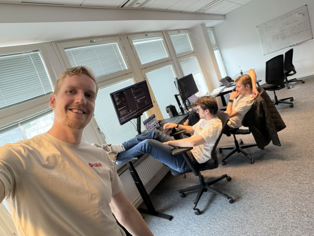 The Spiich team working at standing desks in the Stockholm office